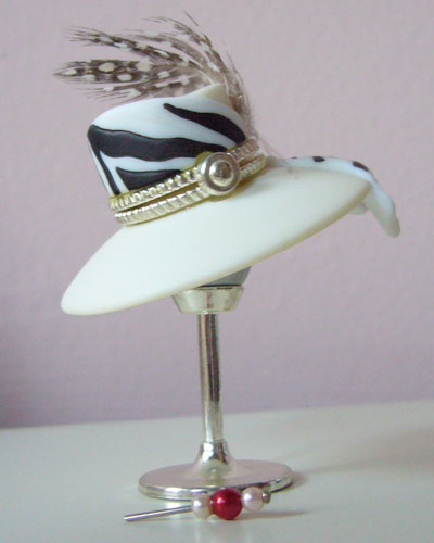 Hat on a stand with hat pin